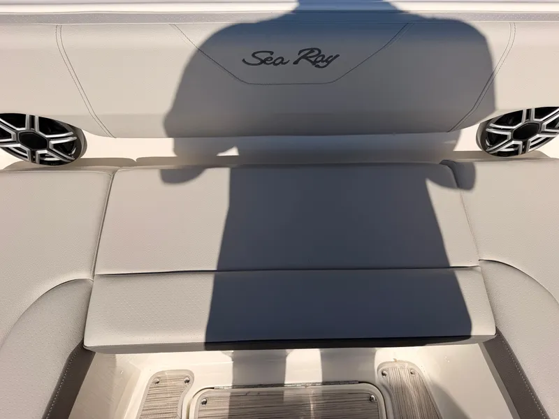 Slide: The Image of Rear seat of a Sea Ray SDX 270 with speakers and embroidered logo. - 61