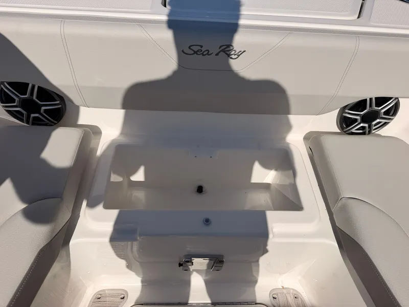 Slide: The Image of Interior of a Sea Ray SDX 270 with speakers and seating. - 62