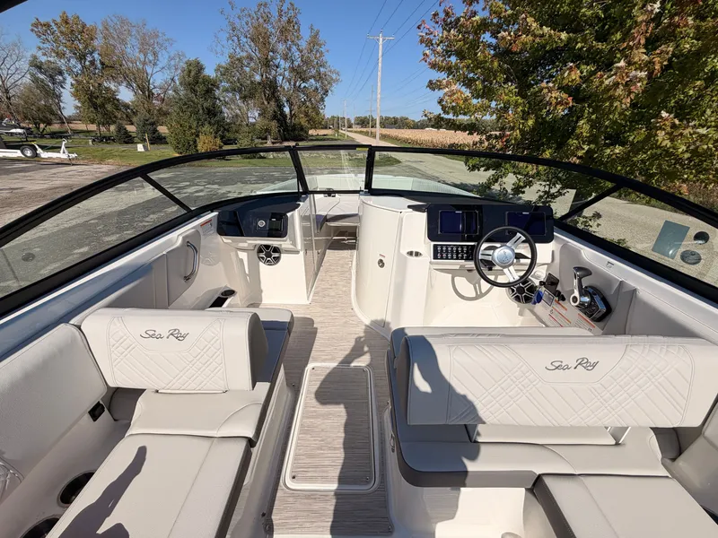 Slide: The Image of The image shows the cockpit of a Sea Ray SDX 270 boat with sleek seating and modern electronics. - 32