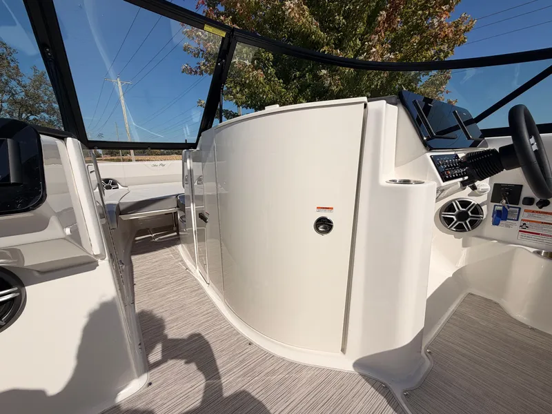Slide: The Image of The image shows the cockpit of a 2026 Sea Ray SDX 270 with modern controls. - 48