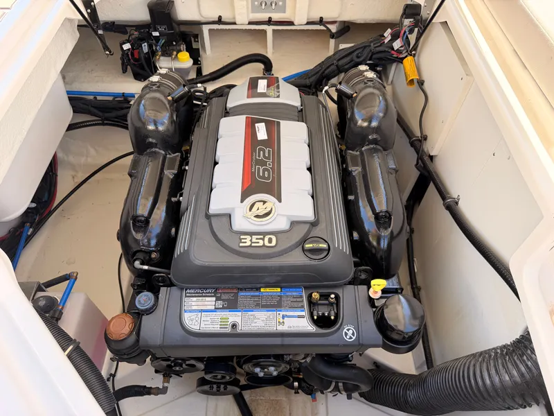 Slide: The Image of Engine compartment of a Sea Ray SDX 270 featuring a 6.2-liter Mercury engine. - 21