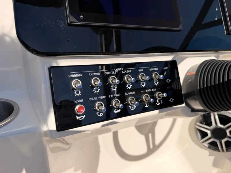 Slide: The Image of Control panel of the Sea Ray SDX 270 with various controls and switches. - 39