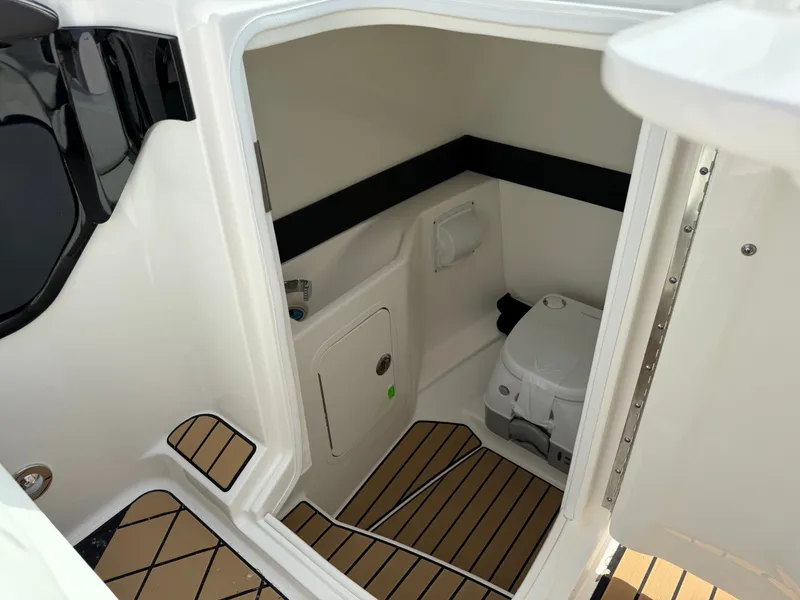 Slide: The Image of Interior of 2026 Sea Ray SLX 260 yacht with toilet. - 14