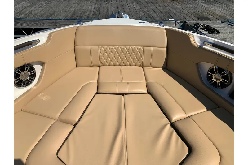 Slide: The Image of Luxurious tan seating on 2023 Sea Ray SLX 280 boat, featuring stylish design and speakers. - 10