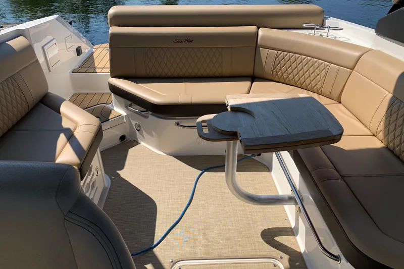 Slide: The Image of Luxurious seating area on 2023 Sea Ray SLX 280 boat with elegant tan upholstery. - 15