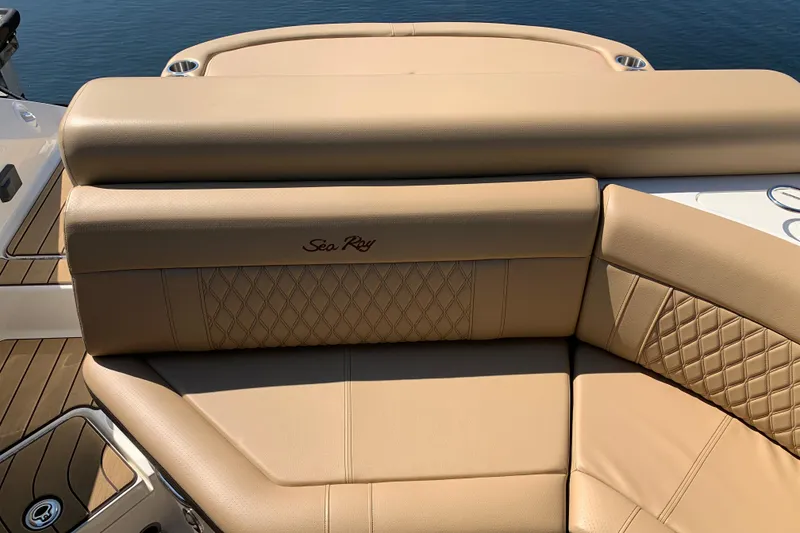 Slide: The Image of Luxurious tan seating on 2023 Sea Ray SLX 280 boat, featuring elegant diamond stitching. - 18