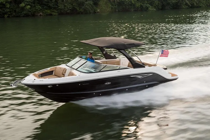 Slide: The Image of Manufacturer Provided Image: 2023 Sea Ray SLX 280 boat cruising on a lake with lush green surroundings. - 21