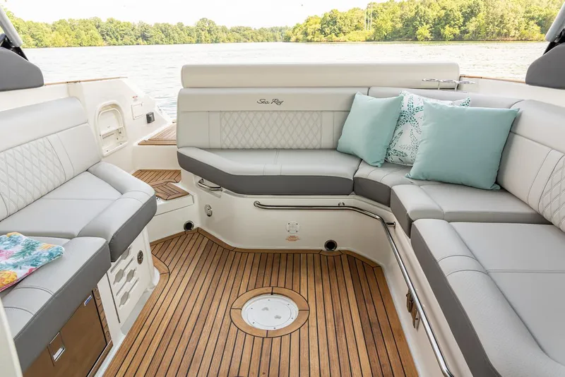 Slide: The Image of Manufacturer Provided Image: 2023 Sea Ray SLX 280 boat interior with luxurious seating and wooden flooring. - 25