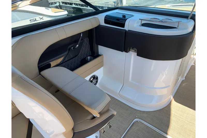 Slide: The Image of 2023 Sea Ray SLX 280 interior with beige seating and sleek design. - 7