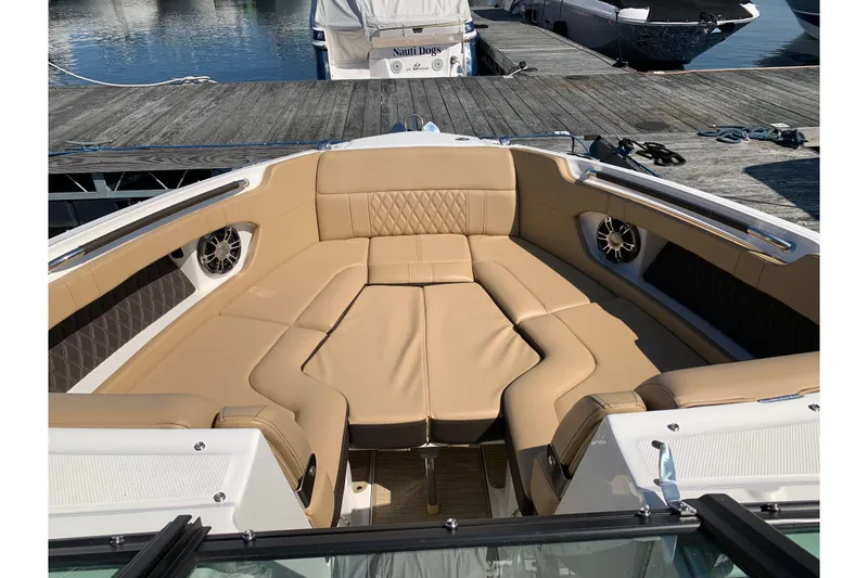 Slide: The Image of Luxurious seating area on 2023 Sea Ray SLX 280 boat, docked at marina. - 8