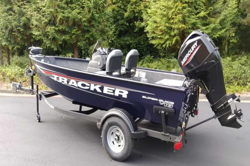 Slide: The Image of 2026 Tracker Super Guide V-16 SC boat with Mercury outboard motor on trailer. - 50