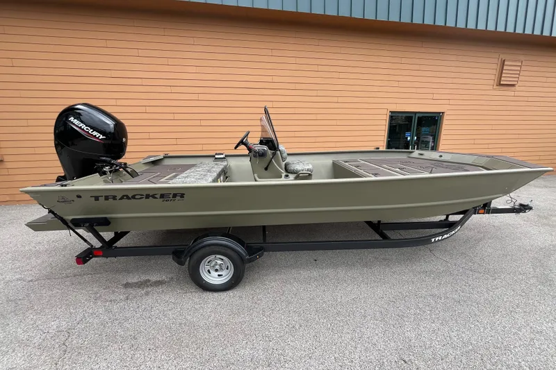 The Image of 2026 Tracker Grizzly 2072 CC boat on trailer, parked outdoors. - 0