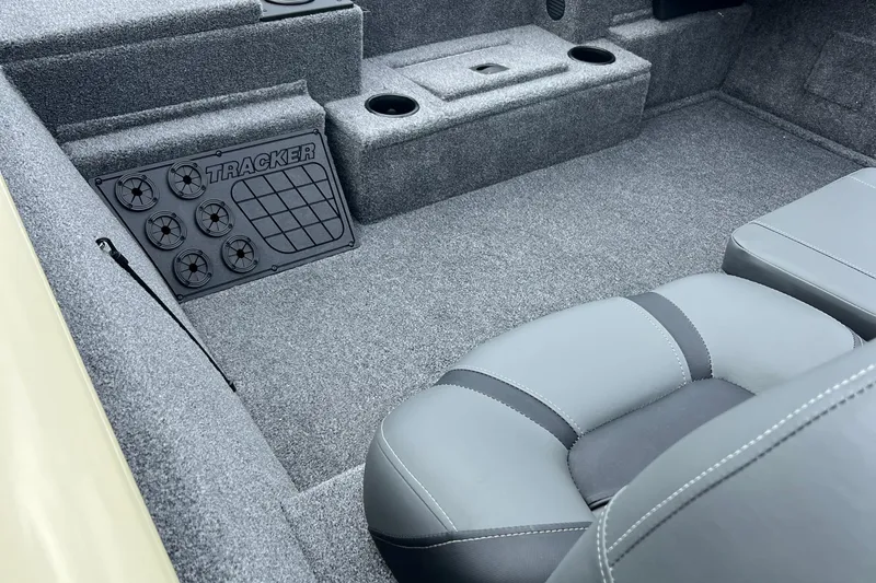 Slide: The Image of Interior of 2026 Tracker Pro Team 195 boat with gray seating and carpeted flooring. - 2