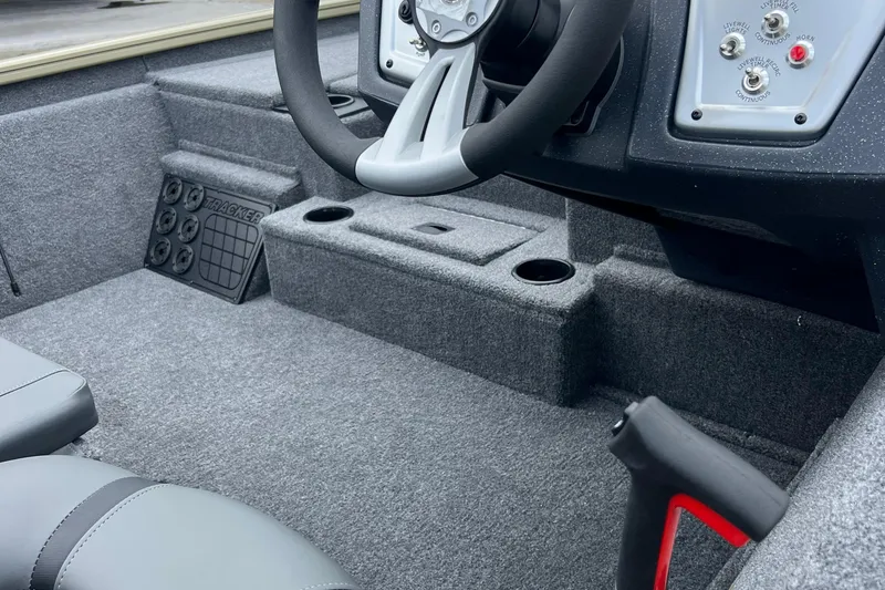 Slide: The Image of 2026 Tracker Pro Team 195 boat interior with steering wheel and control panel. - 3