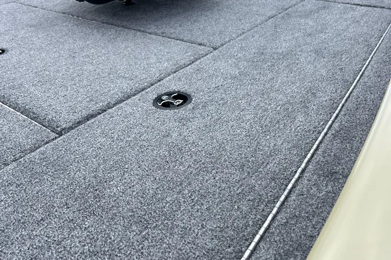 Slide: The Image of Carpeted deck of 2026 Tracker Pro Team 195 boat, featuring storage compartment. - 4