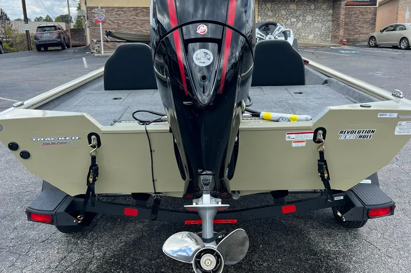 Slide: The Image of 2026 Tracker Pro Team 195 boat with outboard motor in parking lot. - 5