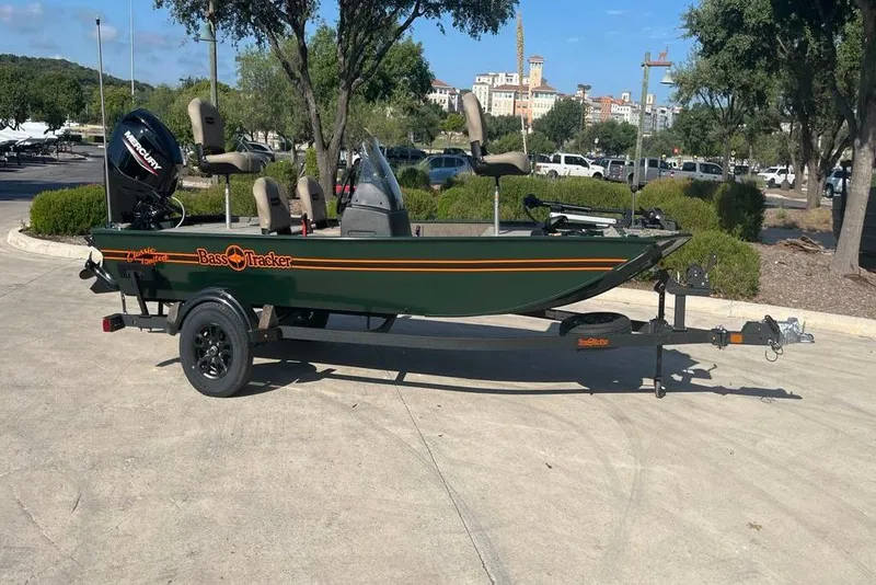 Slide: The Image of 2026 Tracker Bass Tracker Classic Limited boat on trailer in outdoor setting. - 41