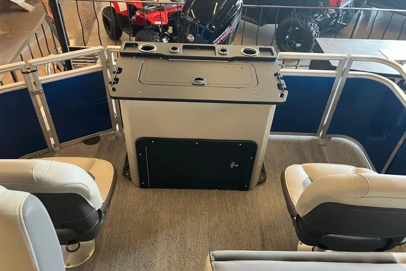 Slide: The Image of Interior of 2026 Sun Tracker Fishin' Barge 20 DLX with seating and control panel. - 5
