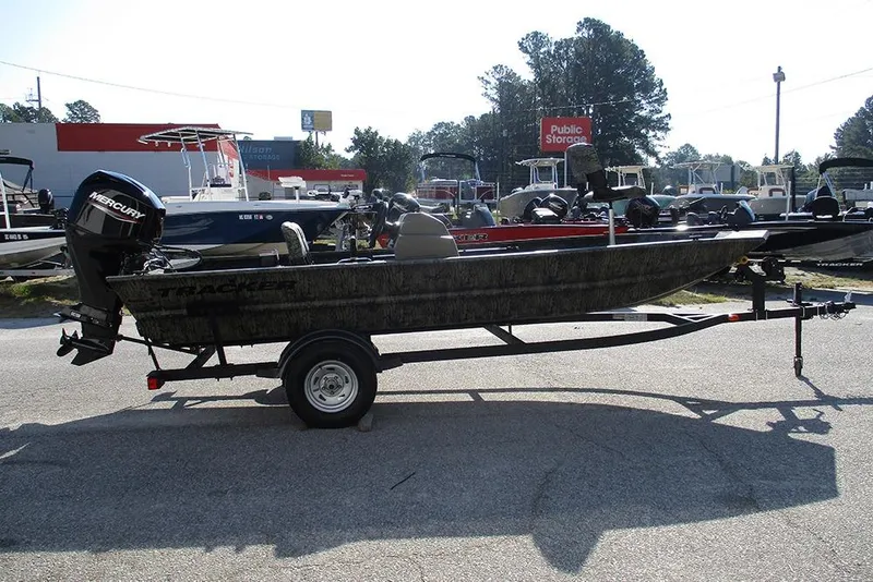The Image of 2026 Tracker Grizzly 1754 SC boat on trailer, parked outdoors at dealership. - 1