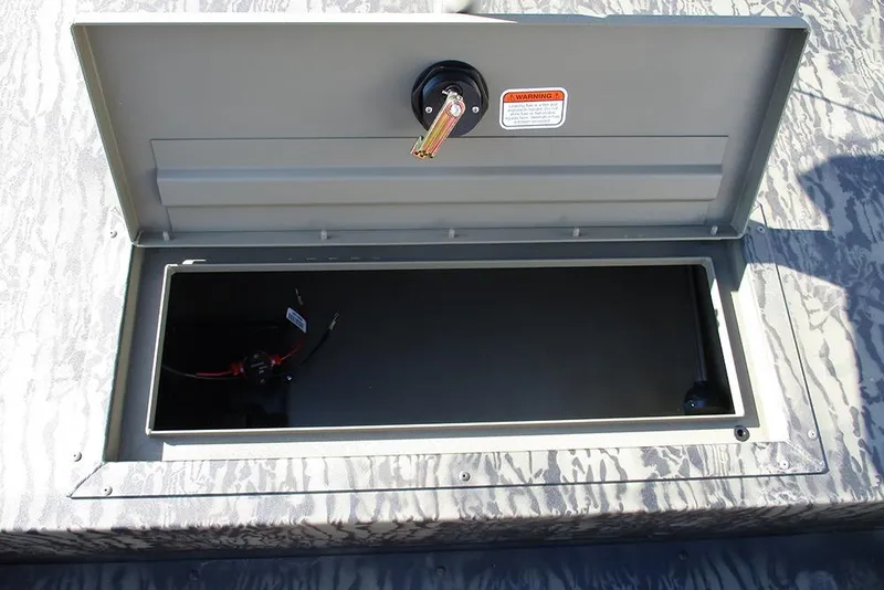 Slide: The Image of Open storage compartment on 2026 Tracker Grizzly 1754 SC boat. - 12