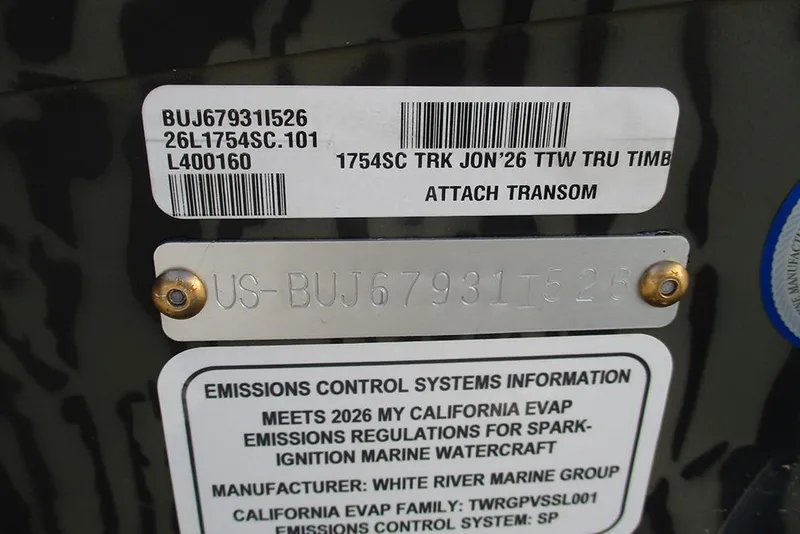 Slide: The Image of 2026 Tracker Grizzly 1754 SC transom label with emissions control information and serial number. - 22