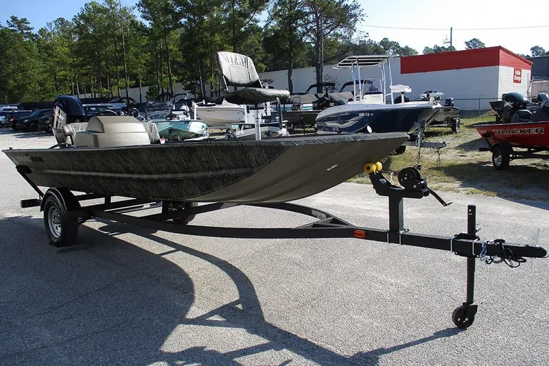 Slide: The Image of 2026 Tracker Grizzly 1754 SC boat on trailer in outdoor dealership lot. - 3