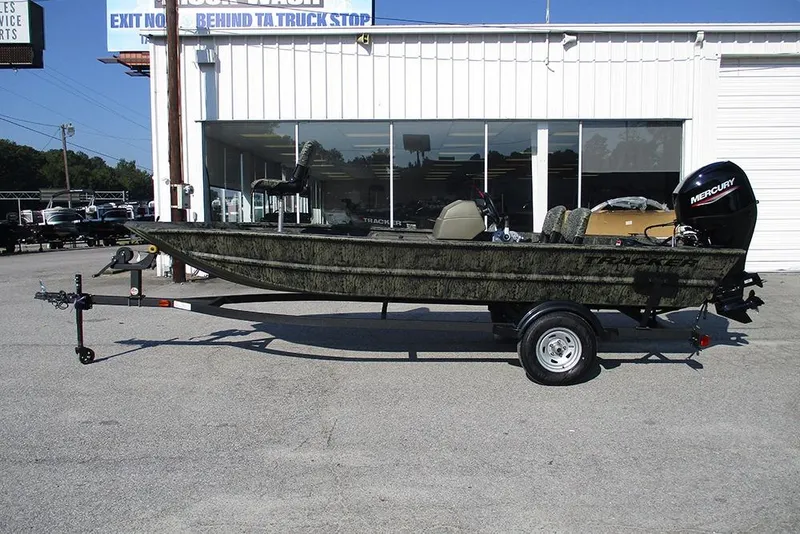 Slide: The Image of 2026 Tracker Grizzly 1754 SC boat on trailer, parked outside dealership. - 6