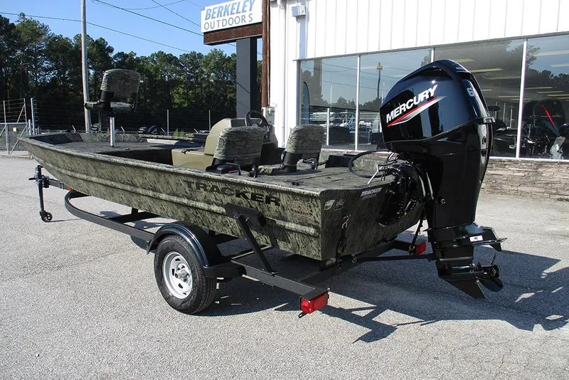 Slide: The Image of 2026 Tracker Grizzly 1754 SC boat with Mercury engine, parked outside Berkeley Outdoors. - 7