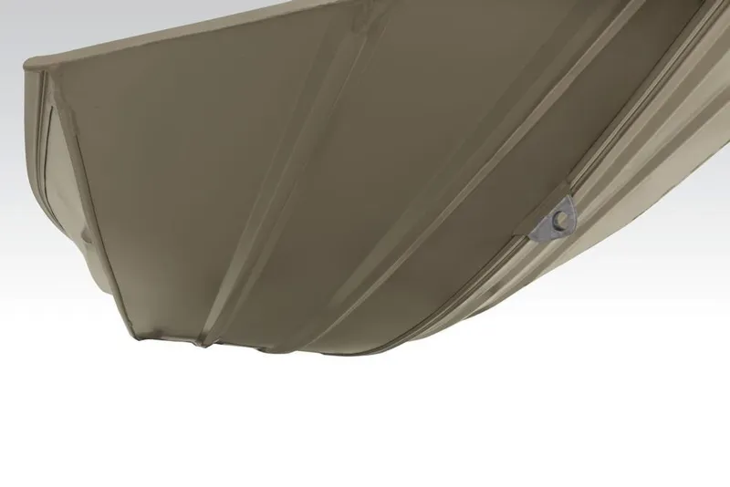 Slide: The Image of 2026 Tracker Grizzly 1754 Utility boat with camouflage interior, parked in a lot. - 6