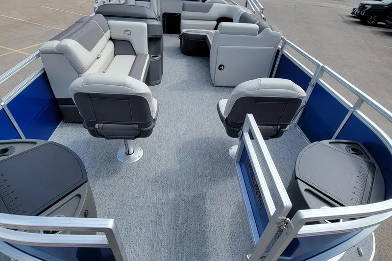 Slide: The Image of 2026 Sun Tracker Fishin' Barge 20 DLX interior with comfortable seating and fishing amenities. - 2