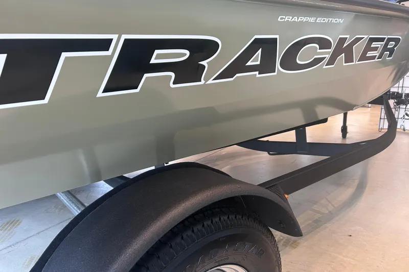 Slide: The Image of 2026 Tracker Pro Team 175 Crappie Edition boat on trailer, close-up view. - 11