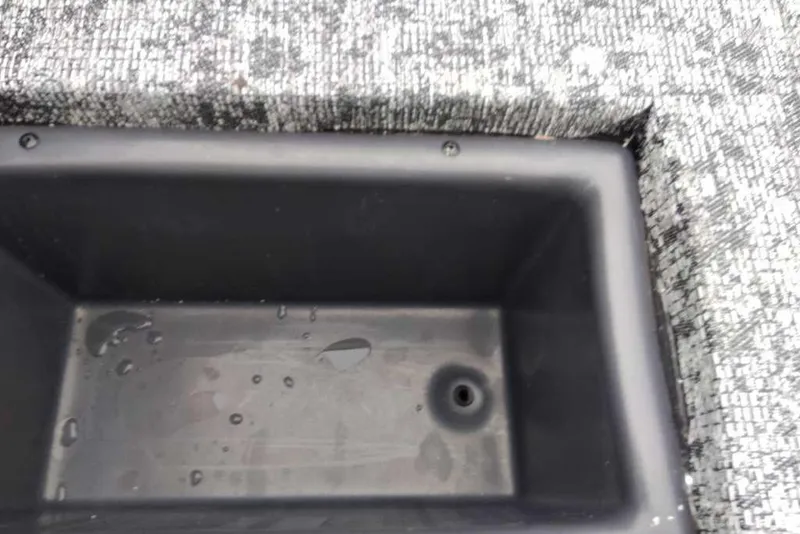 Slide: The Image of Storage compartment in 2026 Tracker Pro Team 175 boat with water droplets. - 65