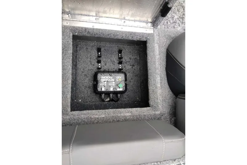 Slide: The Image of NOCO Genius GEN5X2 charger installed in 2026 Tracker Pro Team 175 boat compartment. - 67