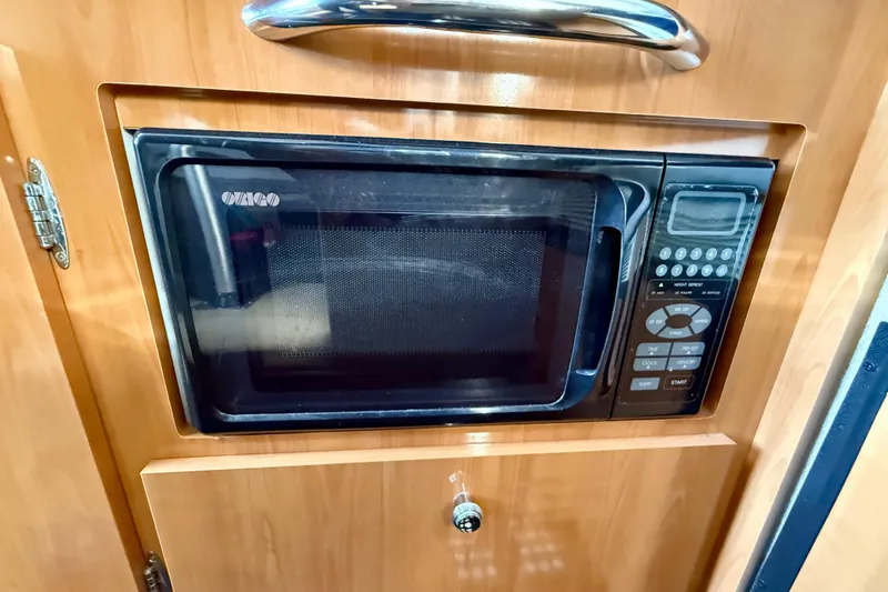 Slide: The Image of Built-in microwave in 2002 Bayliner 2452 Ciera Classic boat kitchen. - 10