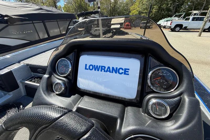 Slide: The Image of Dashboard of a 2017 Triton 18 TrX boat with Lowrance display and gauges. - 11