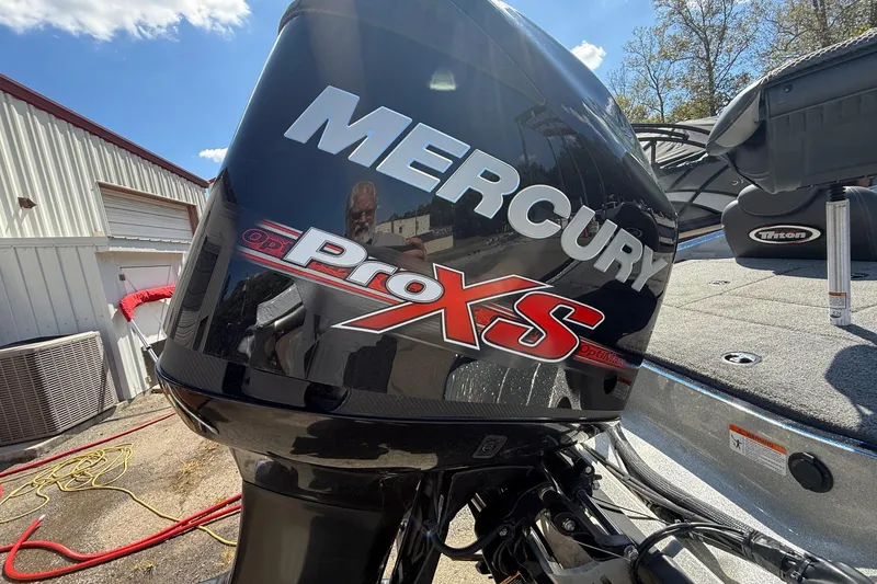 Slide: The Image of Mercury Pro XS engine on a 2017 Triton 18 TrX boat, outdoor setting. - 21