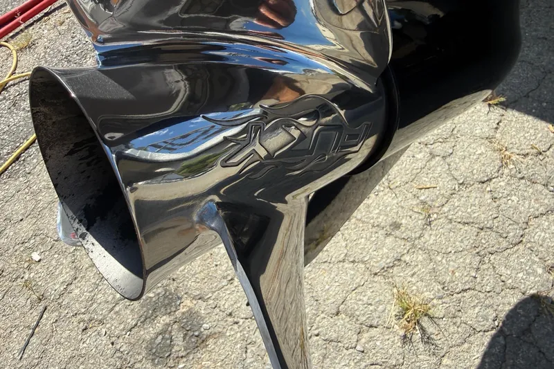 Slide: The Image of Close-up of a shiny propeller on a 2017 Triton 18 TrX boat. - 24