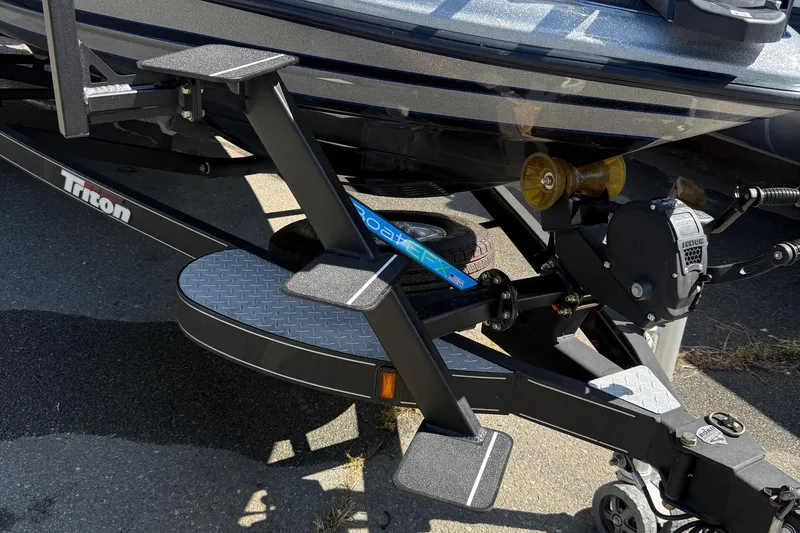 Slide: The Image of 2017 Triton 18 TrX boat trailer with step ladder and winch system. - 27