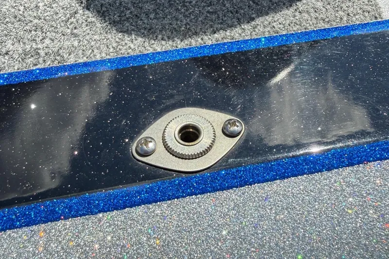 Slide: The Image of Close-up of a 2017 Triton 18 TrX boat detail with metallic blue and silver finish. - 28