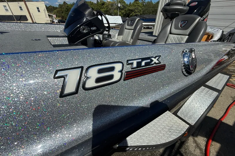 Slide: The Image of 2017 Triton 18 TrX boat with glittery silver finish and comfortable seating. - 3