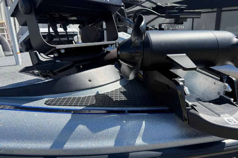 Slide: The Image of 2017 Triton 18 TrX boat with trolling motor detail, showcasing sleek design and equipment. - 7