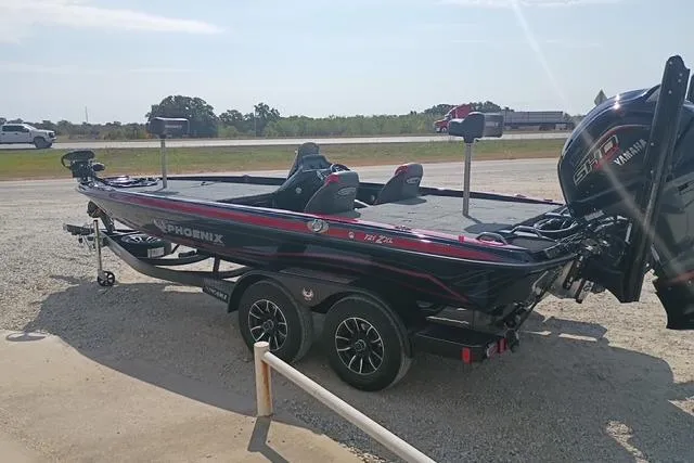 Slide: The Image of 2026 Phoenix 721 ZXL bass boat on trailer, parked outdoors, featuring Yamaha engine. - 3