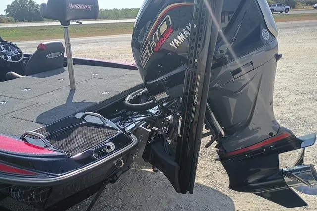 Slide: The Image of 2026 Phoenix 721 ZXL boat with Yamaha engine, rear view on a sunny day. - 4