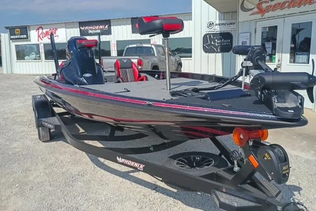 Slide: The Image of 2026 Phoenix 721 ZXL bass boat on trailer, parked outside dealership. - 5