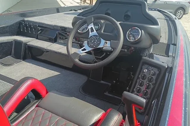 Slide: The Image of 2026 Phoenix 721 ZXL boat interior with steering wheel and dashboard controls. - 7