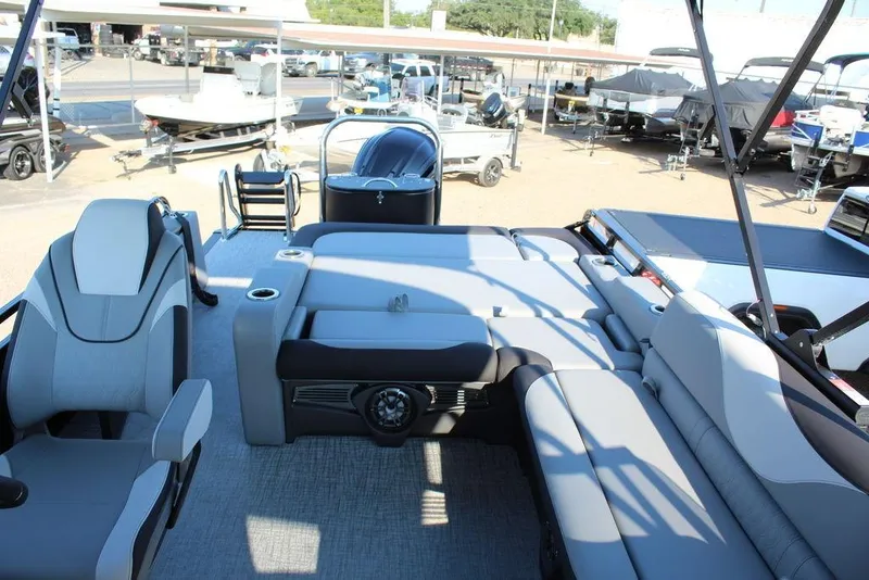 Slide: The Image of 2026 Avalon LSZ Versatile Rear Bench Windshield 27 FT boat interior with seating and helm. - 10