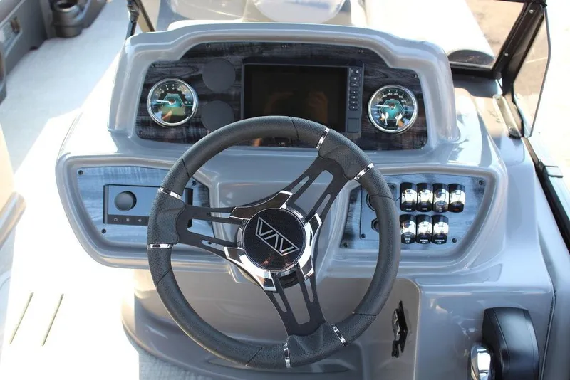 Slide: The Image of Steering console of 2026 Avalon LSZ Versatile Rear Bench Windshield 27 FT boat. - 17