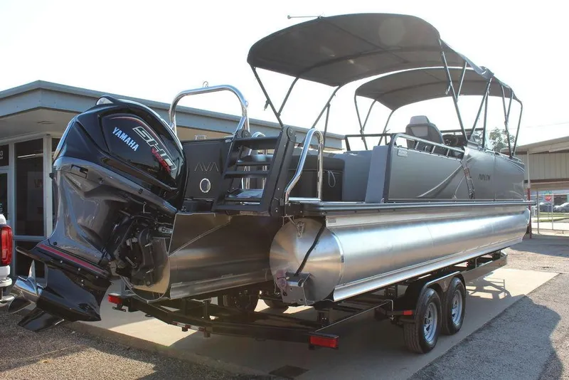 Slide: The Image of 2026 Avalon LSZ Versatile Rear Bench Windshield 27 FT pontoon boat with Yamaha engine. - 2