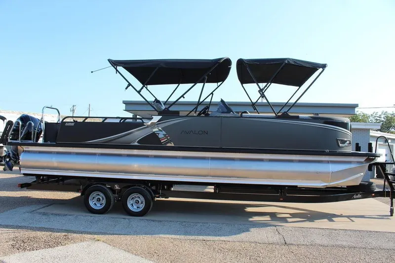 Slide: The Image of 2026 Avalon LSZ Versatile Rear Bench Windshield 27 FT pontoon boat on trailer. - 3