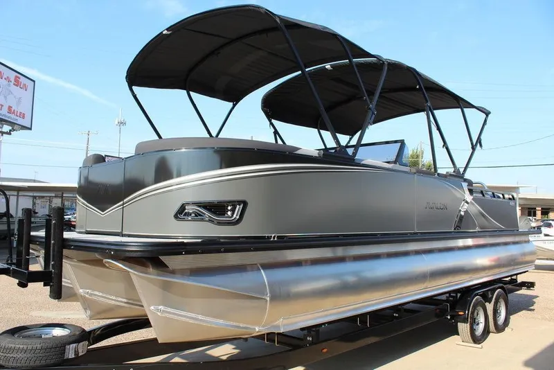 Slide: The Image of 2026 Avalon LSZ Versatile Rear Bench Windshield 27 FT pontoon boat on trailer. - 5
